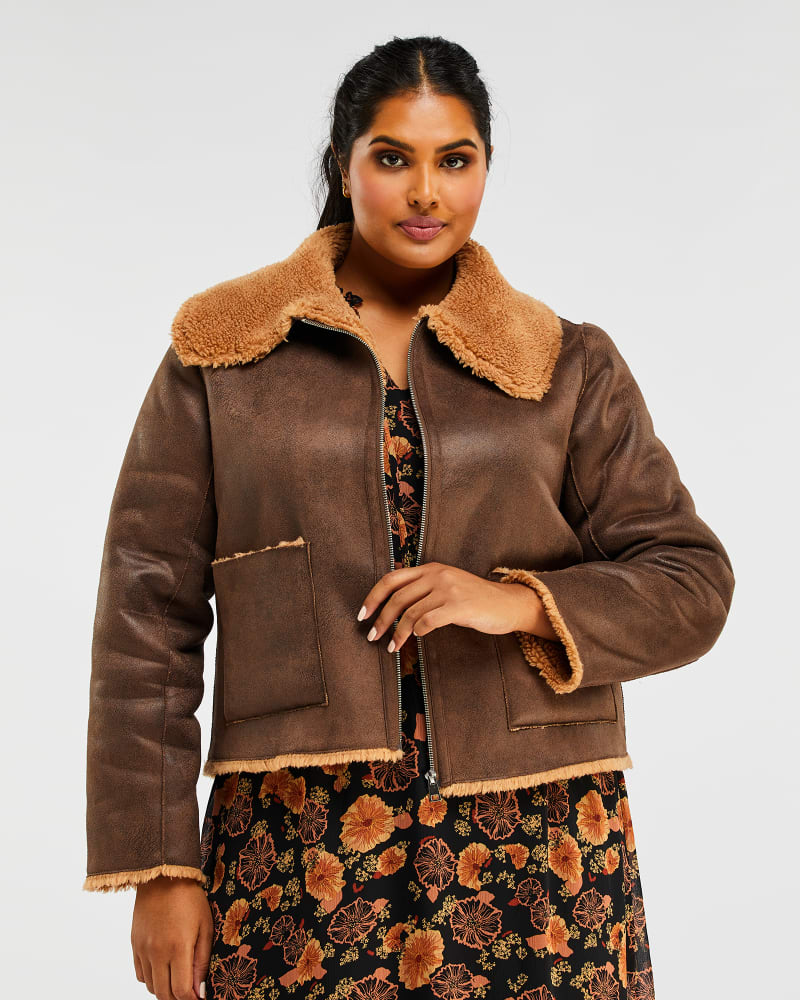 Front of a model wearing a size 1X Lenny Jacket in Chocolate/Tan by Estelle. | dia_product_style_image_id:235039